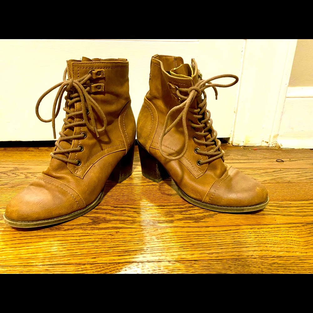 Brown leather lace up boots with textile lining.